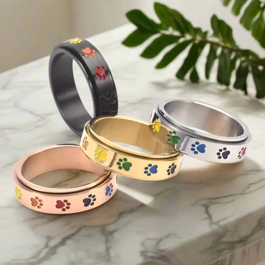 Drejelig anti-stress-ring i rustfrit stål med regnbuepoter